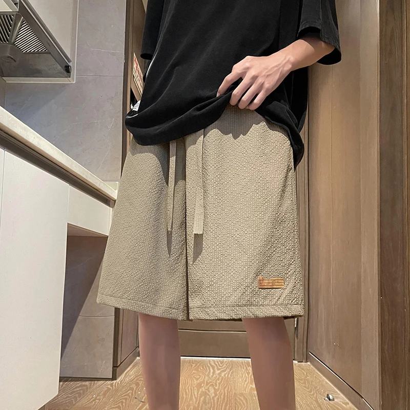 Fashion Solid Color Spliced Pockets Casual Shorts Men's Clothing 2024 Summer New Loose Elastic Lace Up High Waist Knee Shorts