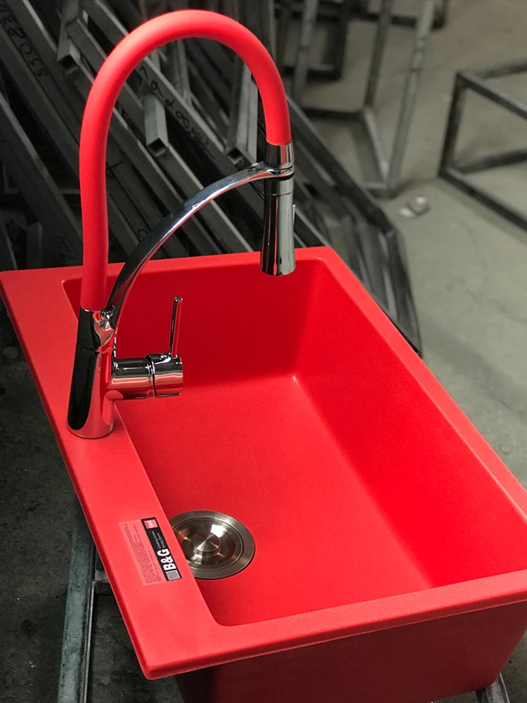 

Red quartz stone sink color pool kitchen package with refined copper pull faucet to wash dishes under the platform.