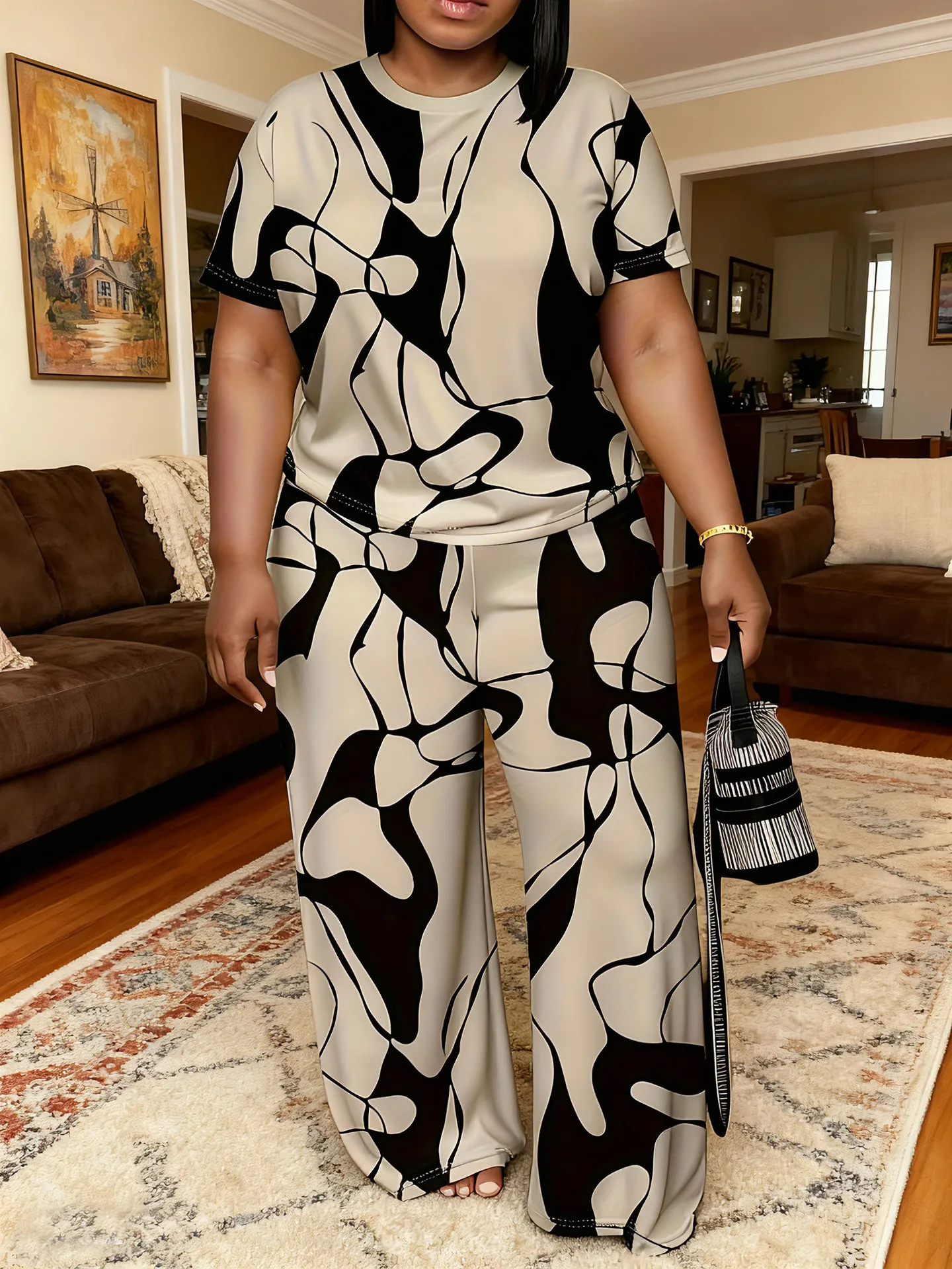 Women's summer fashion print two-piece outfit with round-neck short sleeve T-shirt and wide-leg trousers in a relaxed fit. 65496
