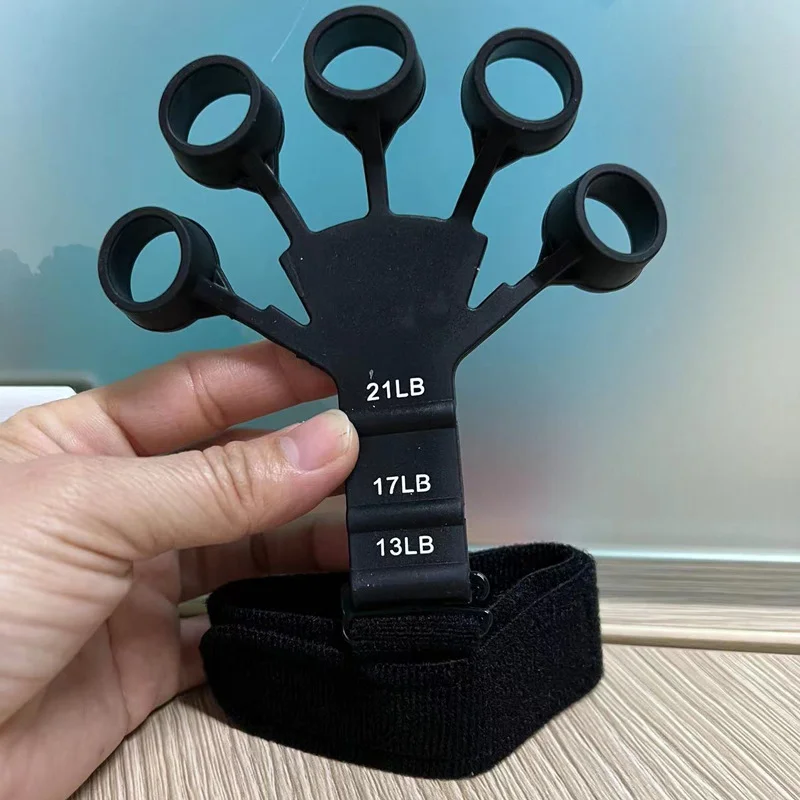 

1Pc Finger Gripper Guitar Finger Flexion Extension Training Durable 6 Resistant Finger Exerciser with Adjustable Wrist Strap