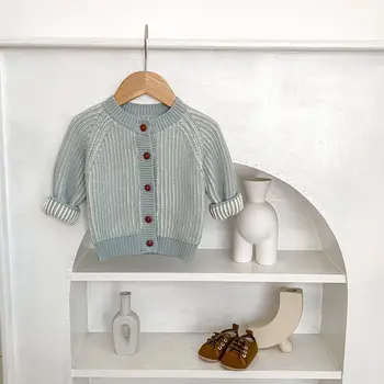 Autumn new 0-3-year-old baby clothes, girls and boys two-color Twists braid knitting round neck long sleeved cardigan
