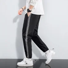 

New spring and autumn men's large size loose casual sports wild bundle feet men's trousers