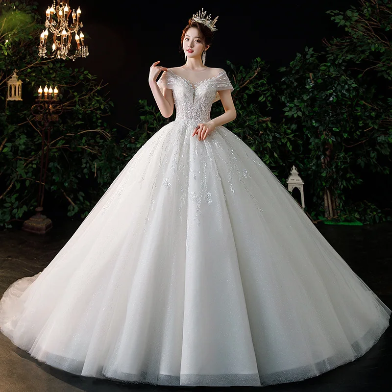 

Exquisite Boat Neck Ivory Dubai Ball Gown Wedding Dress Sparkly Beads Appliques Saudi Arabic Bridal Gown Customize Sizes