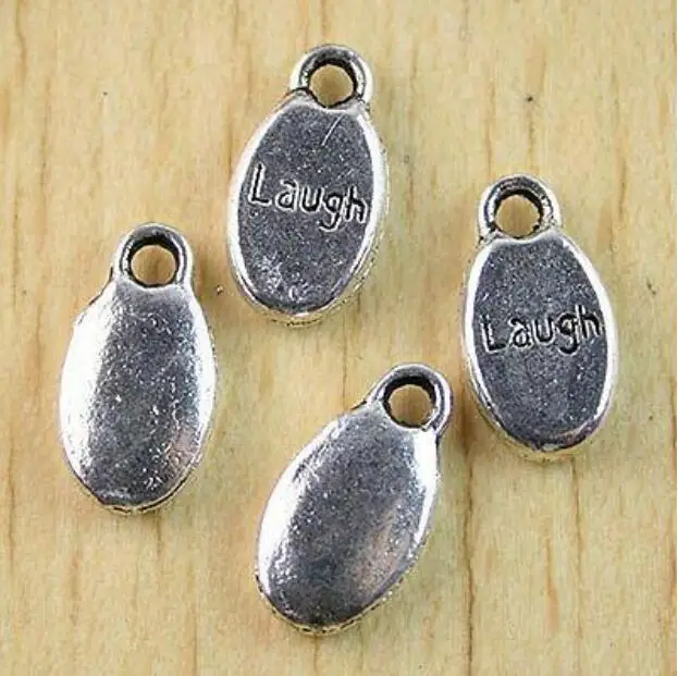 

22Pcs 15.5*8.5mm Tibetan silver LAUGH solid charms H1023