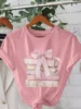 Women's Flirty Books Pile with Bow Graphic Print T-Shirt - Soft Pink Short Sleeve Crew Neck Casual Top Lightweight Summer