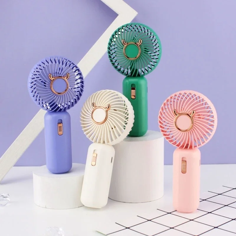 

New Cartoon Drawstring Small Electric Fan Simple Fashionable Silent Night Light Mobile Phone Holder USB Rechargeable Fan