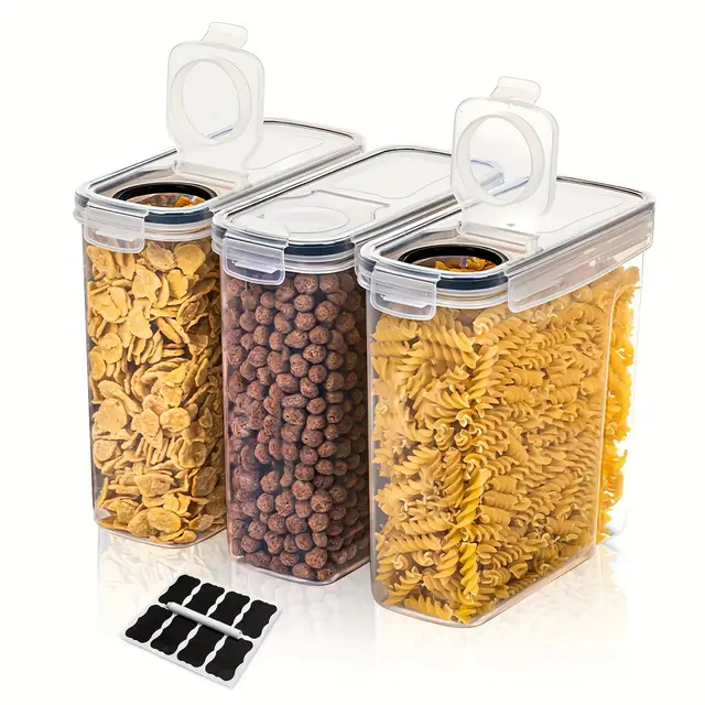 Set of three airtight food storage containers stacked neatly in a kitchen pantry, filled with pasta and cereal.