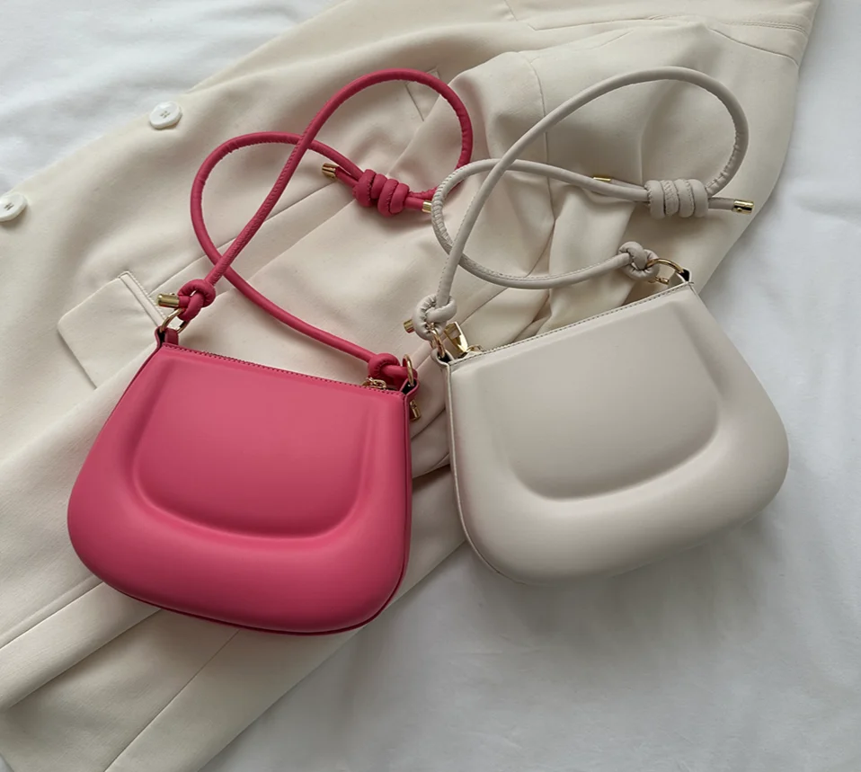 PU leather shoulder handbag with long strapping.