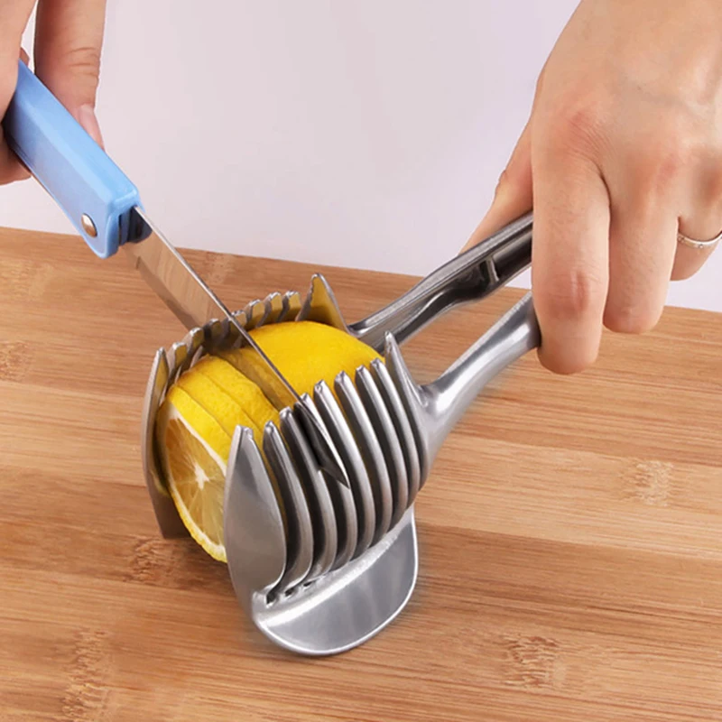 https://ae01.alicdn.com/kf/Sd418f84e99034179a3d44fbdc7aa872do/Hand-held-Fruit-Slicer-Multi-function-Cutter-Tool-Shredders-Clamp-Lemon-Tomato-Cutting-Holder-Cooking-Tools.jpg