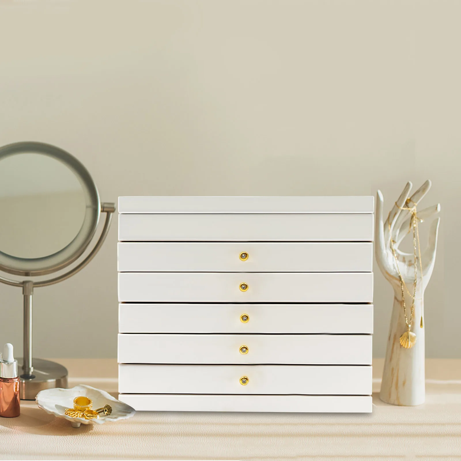 Boîte à bijoux blanche ouverte avec miroir et tiroirs visibles