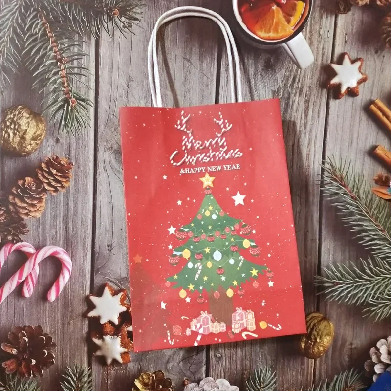 thumbnail image 1 of Bolsas de papel kraft para Navidad 2024, bonitas cajas de regalo de Papá Noel para fiestas navideñas, bolsas de embalaje para galletas y dulces para niños con asa, 1 of 5