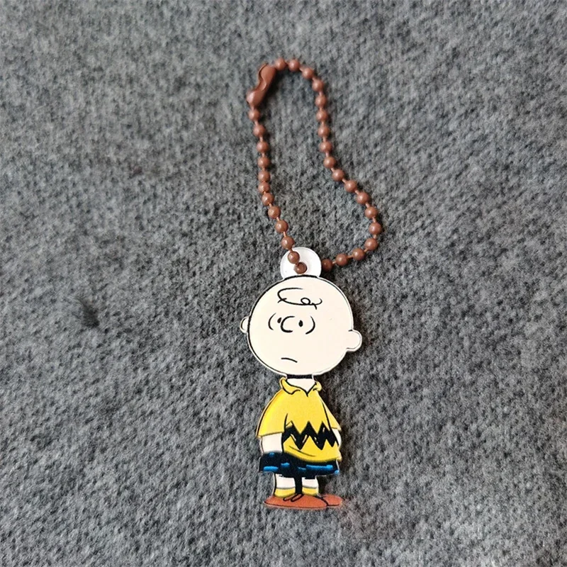 thumbnail image 1 of Llavero con colgante de teléfono de Snoopy Charlie Brown, pareja de anime, colgante de acrílico para mochila escolar, llavero, regalo para niñas y niños, 1 of 5