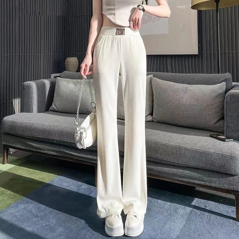 2024 Summer Women's New Spliced Elasticized High-waisted Fashion Solid Color Pocket Comfortable Minimalist Casual Flare Pants