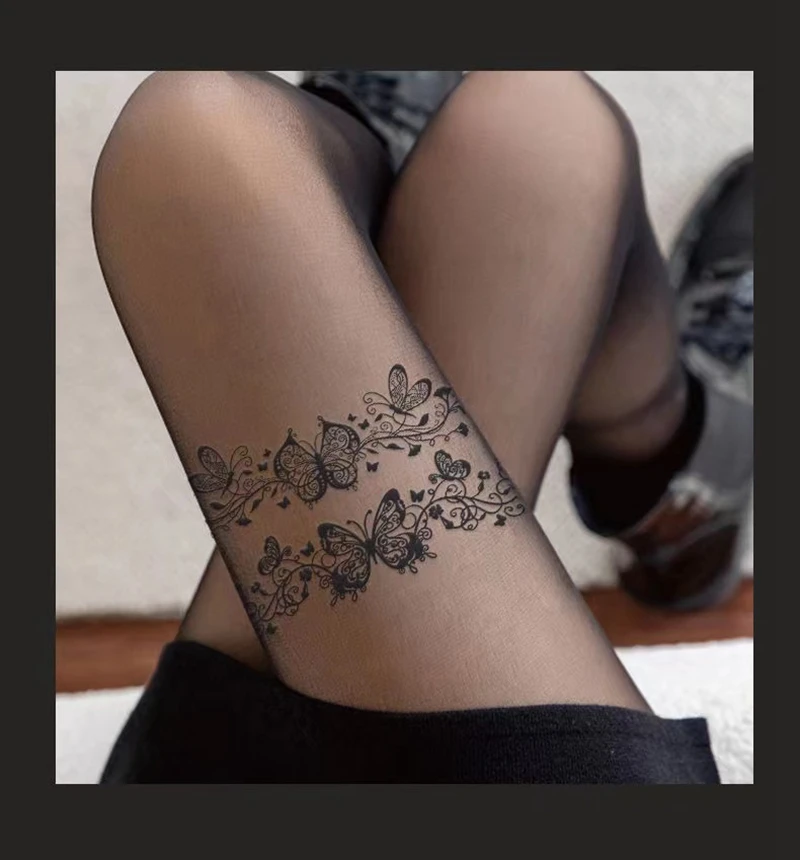 thigh garter tattoo