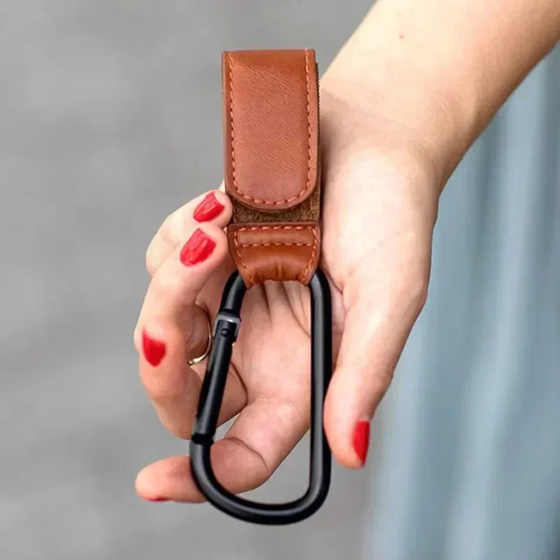 Detail of stroller hook clasp and attachment strap