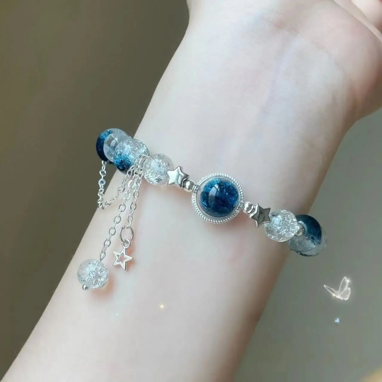 Bracciale elastico con perle cristallo blu e ciondolo a stella_voghion.com
