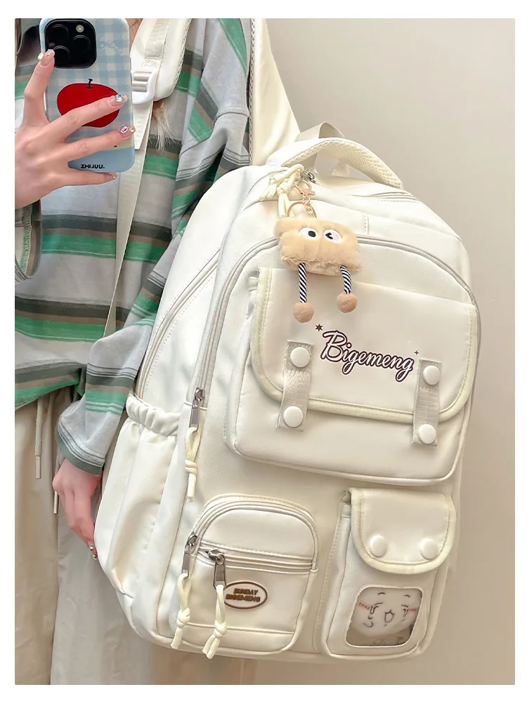 حقيبة ظهر جديدة لعام 2025 لطلاب المدارس الثانوية والمدرسة الابتدائية حقيبة ظهر مدرسية متعددة الاستخدامات مع دمية