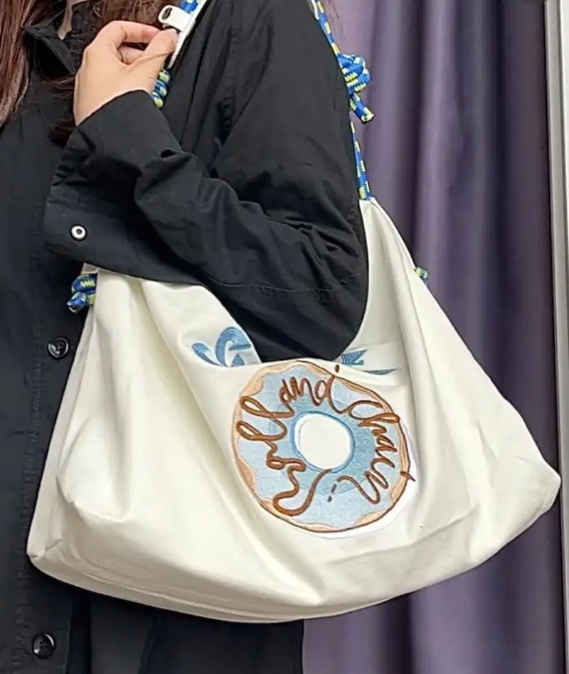 

Japanese 2023 New Embroidered Donut Women's Shoulder Bag Korean High Capacity White Canvas Student Casual Handbags Underarm Bag