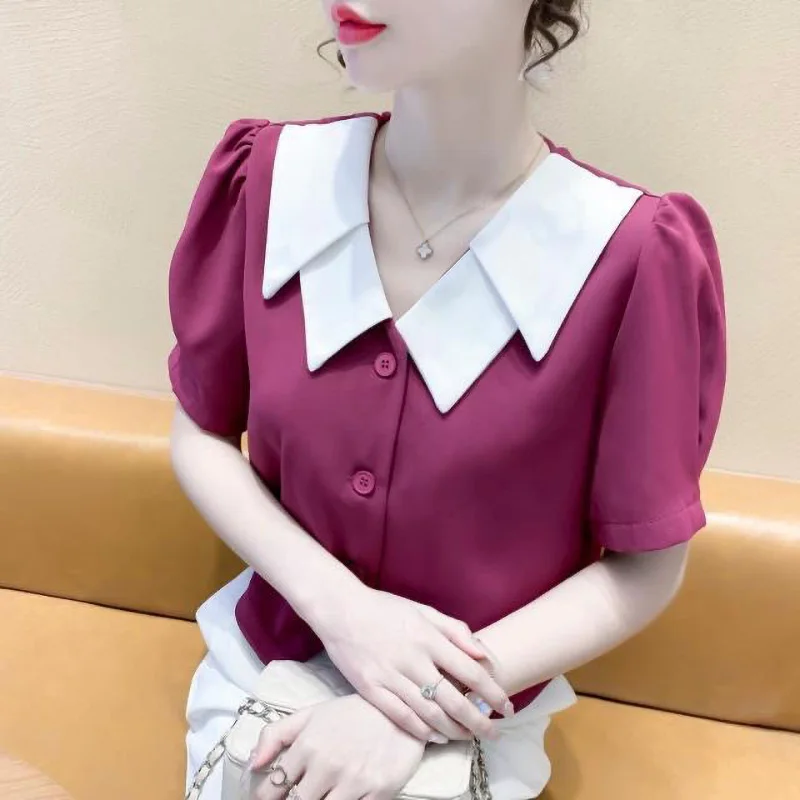 Elegant Peter Pan Collar Button Spliced Asymmetrica Shirt Female Clothing 2024 Summer New Short Sleeve Commute Tops Sweet Blouse