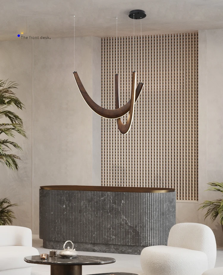 A modern reception area featuring a curved dark front desk, white armchairs, vertical slat wall decor, and the Double Curve Wood Pendant Light.