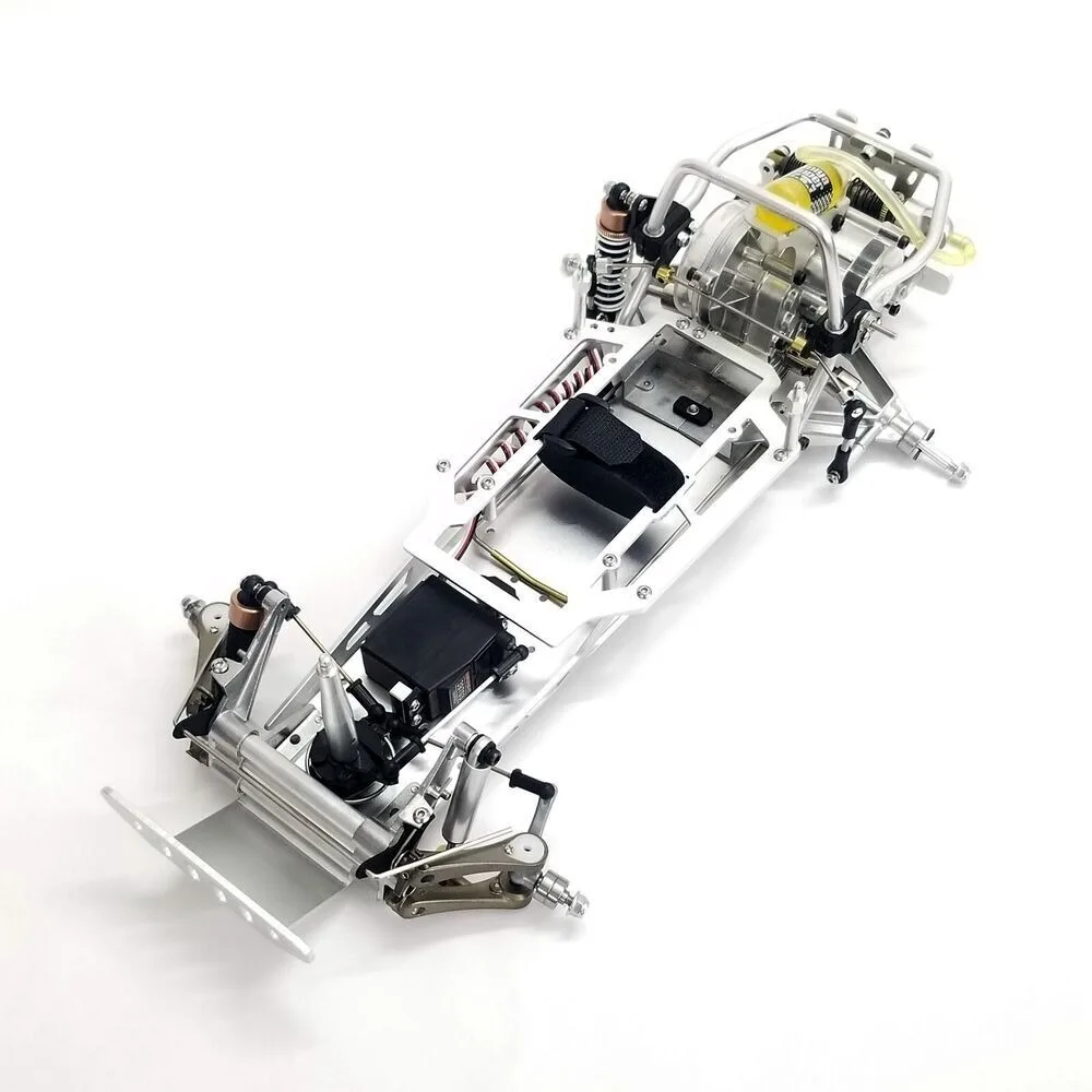 Détail du châssis aluminium pour Tamiya Sand Scorcher Buggy Champ, finition lisse et précise.