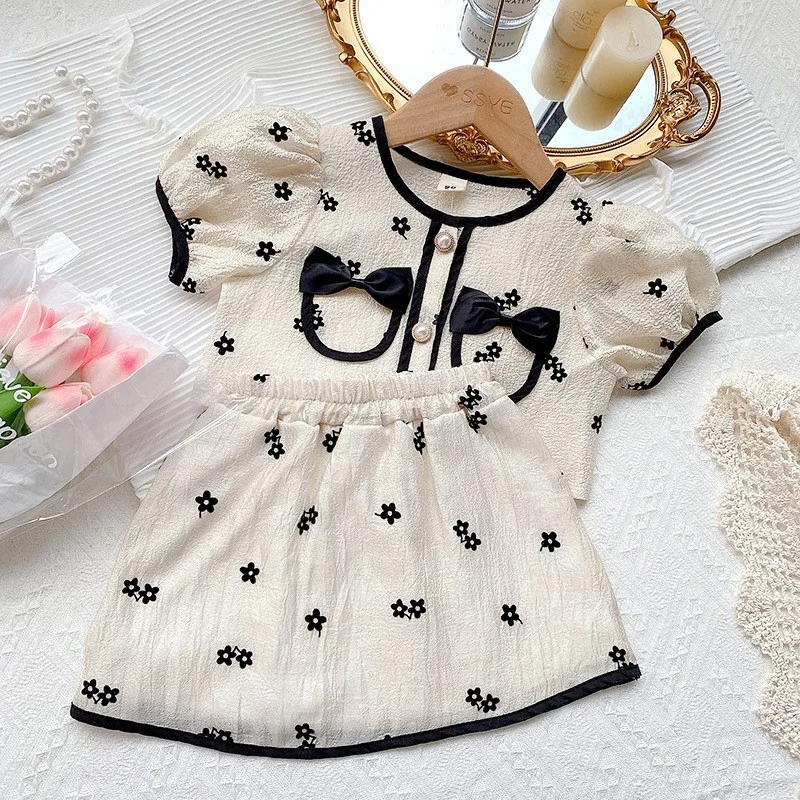 

2024 Summer New Girls Contrast Color Crew Neck Button Spliced Bow Floral Short Sleeve Korean Sweet Slim Elastic Skirt Casual Set