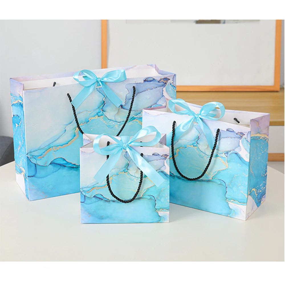

Sky Blue Marble Gift Bags 10Pcs/Lot Kraft Paper Gift Bags Bulk with Handles Ribbon 18x16x10cm Shopping Retail Party Favor Bags