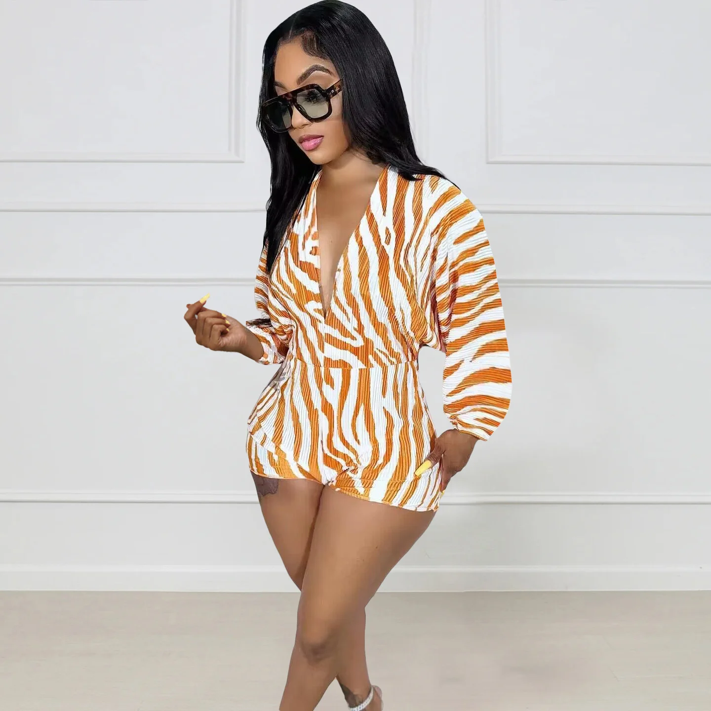 

Zoctuo Orange Striped Casual Romper For Women Summer Long Sleeve Deep V-Neck Pleated One Piece Rompers Sexy Club Wear Party