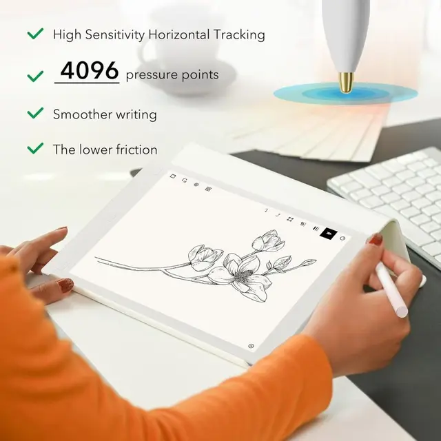 Close-up of a hand writing on a Kindle Scribe screen with the stylus