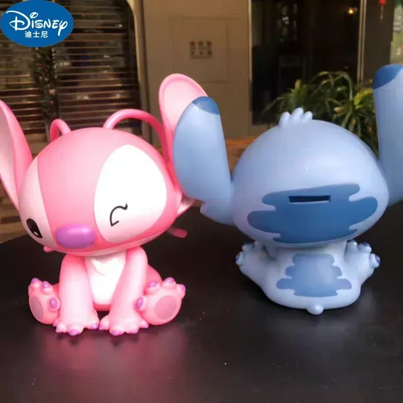 

Disney Stitch Angel Piggy Bank Cartoon Anime Money Box Pvc Action Model Kawaii Doll Decorative Collect Kids Toy Holiday Gift