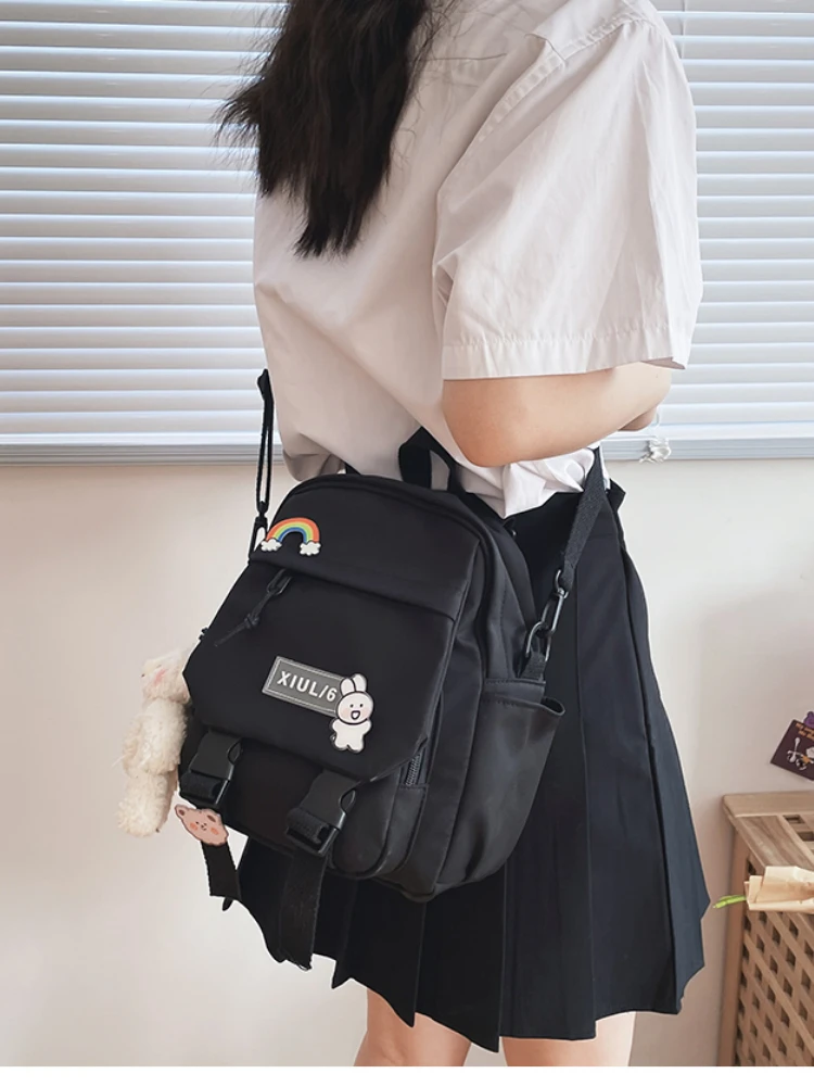 Small pastel backpack for women and girls with dual-use straps, kawaii design, and roomy compartments for school, travel, and casual wear.07