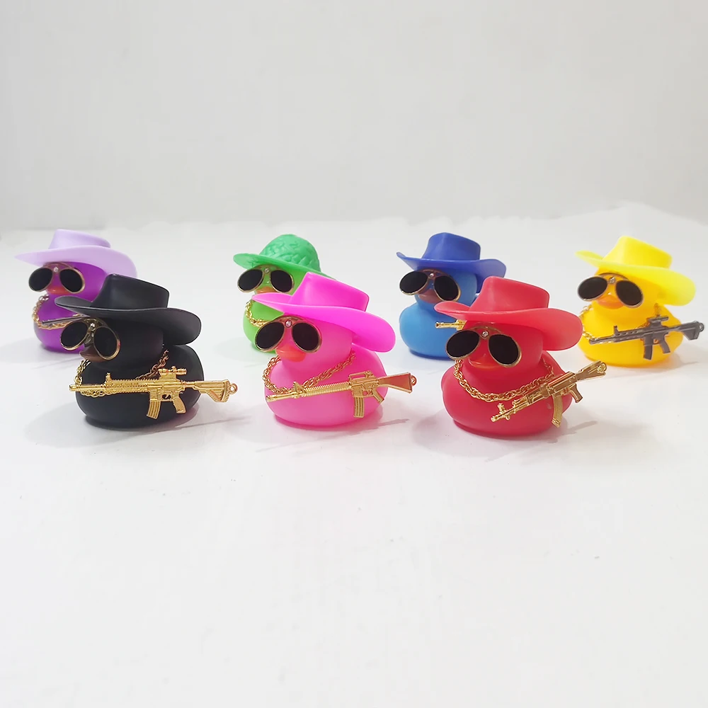 Vibrant Yellow Duckling with Weapon - Cute Rubber Dashboard Ornament