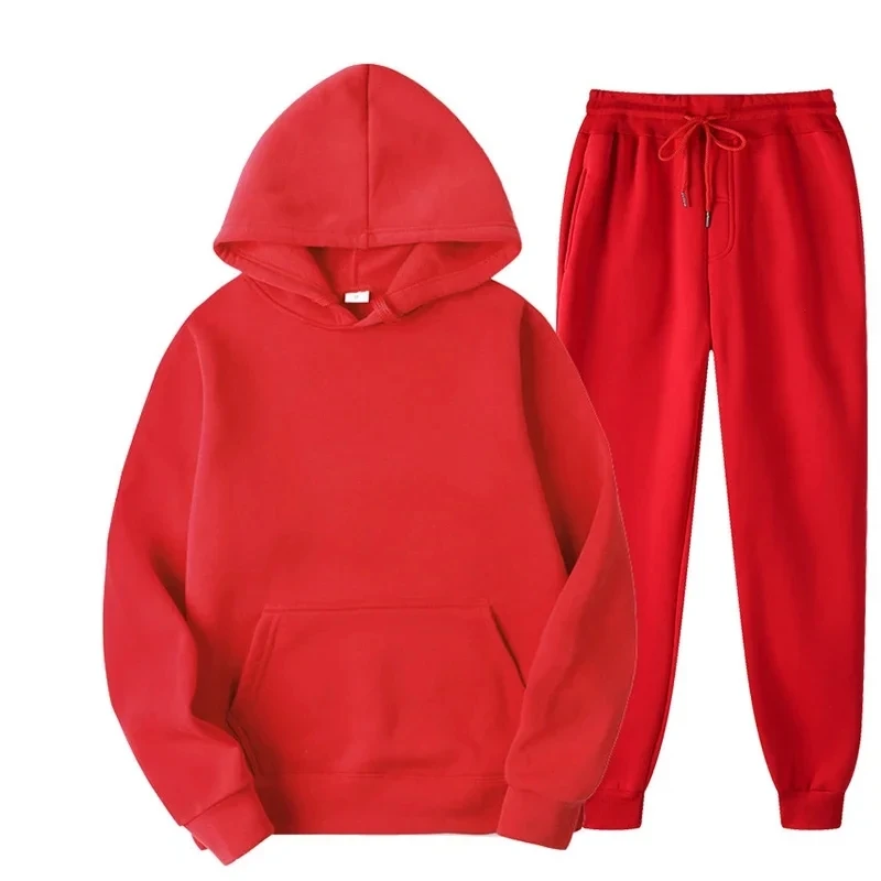 Man wearing solid color hoodie and jogger pants set in a cozy autumn streetwear setting red