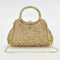 Abendtasche in ungewöhnlicher Form mit Strass Gold