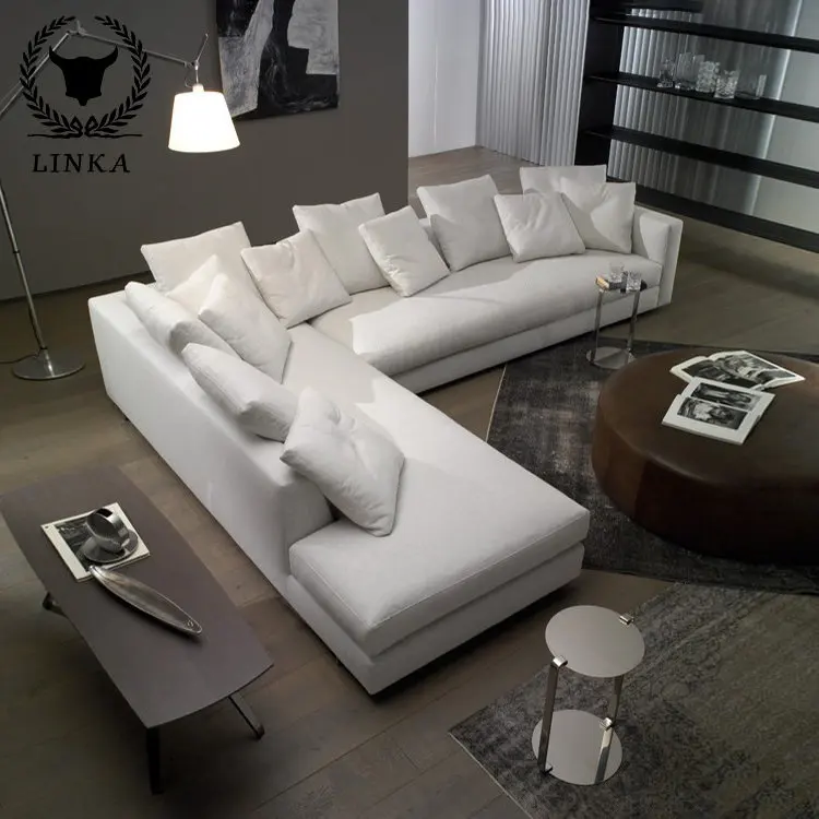 

Comfortable Sofa Made of White Segmented Fabric in The Corner of Modern L-shaped Room