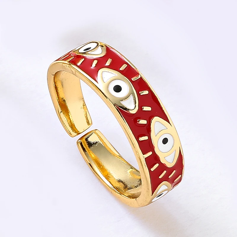 Anel dourado e vermelho