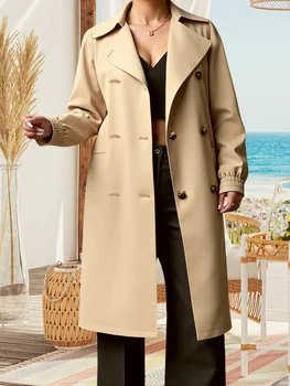 A woman wearing a elegant, belted plus size wool coat on a winter day.