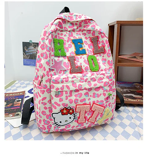 New style school bag for junior high school students, hellokitty bag, lazy and cute pink leopard print large capacity backpack wild girl schoolbag female mori department bump color cute high school students ins wind harajuku junior high school backpack