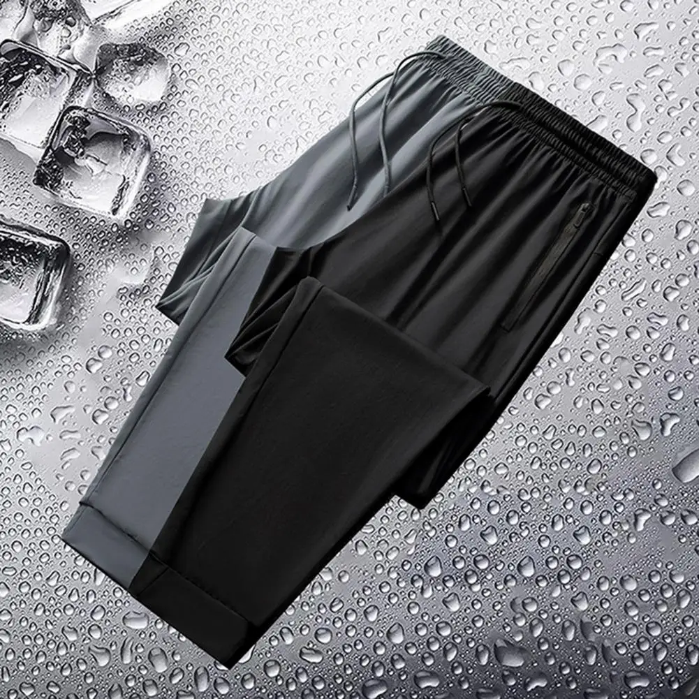 

Solid Color Sweatpants Men's Quick-drying Ice Silk Sport Pants with Wide Leg Side Pockets for Gym Training Jogging Elastic Waist