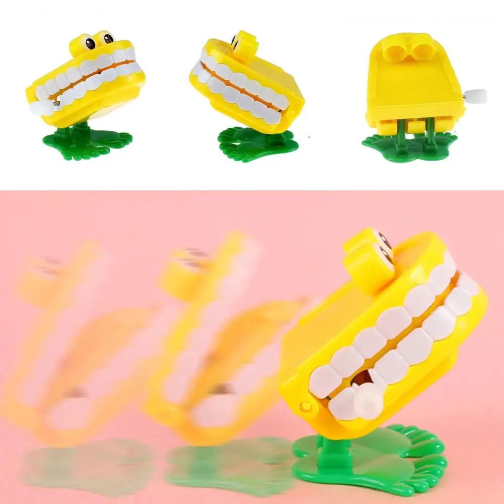 

1pcs Wind Up Teeth Mechanical Toy Halloween Prank Decoration Running Jump Clockwork Wind Teeth Up Walking Spring Toys O0V5