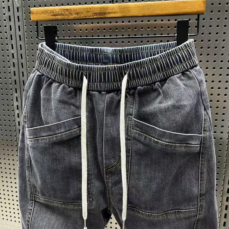 New Arrival Korean Style Fashion Stretch Denim Jeans for Men Elastic Waistband Drawstring Design Harem Jeans Cotton Trousers