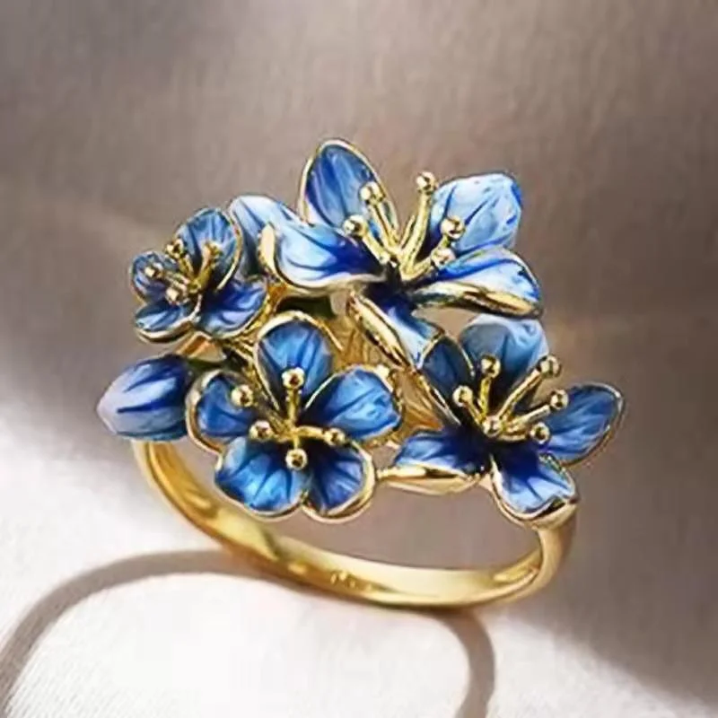 

Ofertas Creative Gold Color Beautiful Blue Flower Plants Alloy Female Ring for Women Party Jewelry Accessories