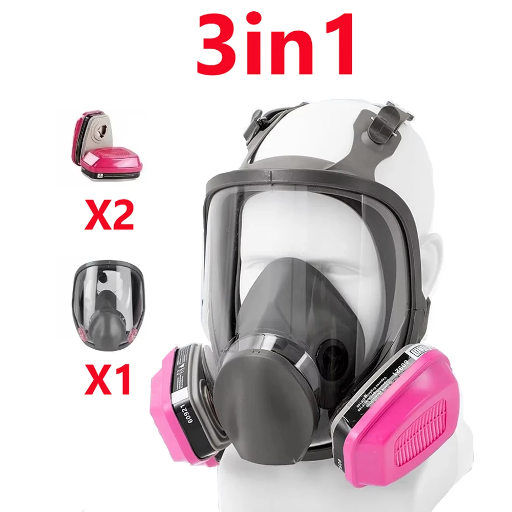 Lot de 3 masques réutilisables avec filtres, couleurs noir, bleu et rose, posés à plat.