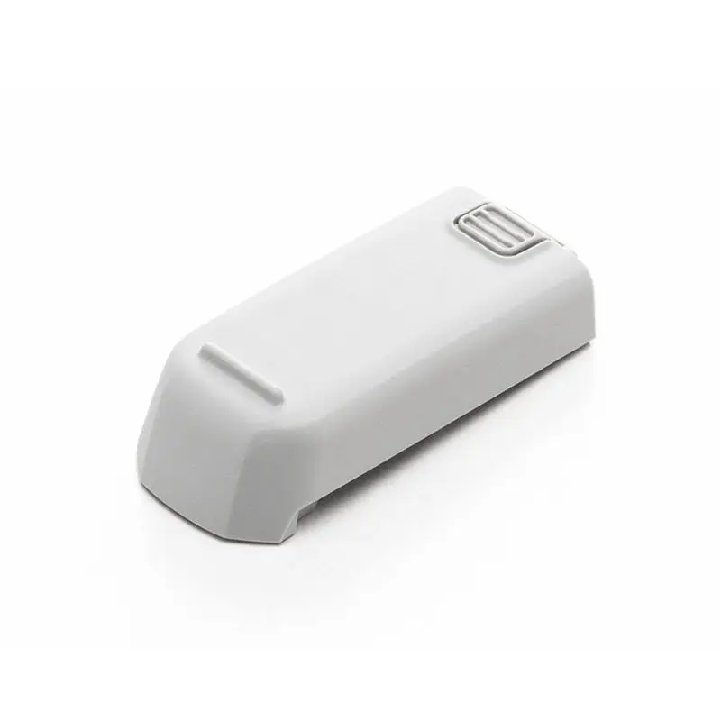 Ensemble drone DJI gris clair avec trois batteries et chargeur, emballé pour livraison rapide.