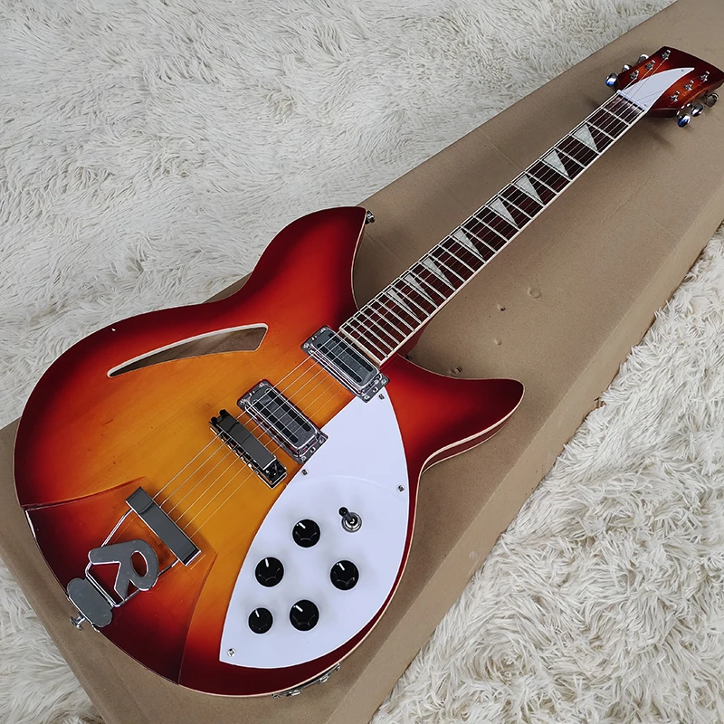 

This is a classic electric guitar, orange in color, made of solid wood, with beautiful sound. It is free to mail home
