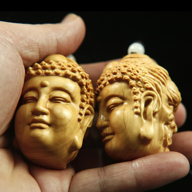 

Boxwood carving hand between a read Buddha head Buddha magic text play solid wood car pendant arts and crafts collection play
