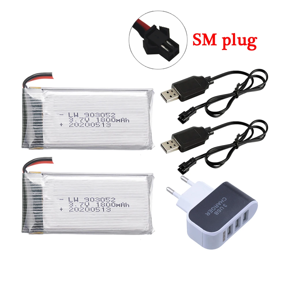 Détail du boîtier de commande et de l'hélicoptère RC télécommandé pas cher, mettant en avant les boutons de contrôle et la batterie amovible.