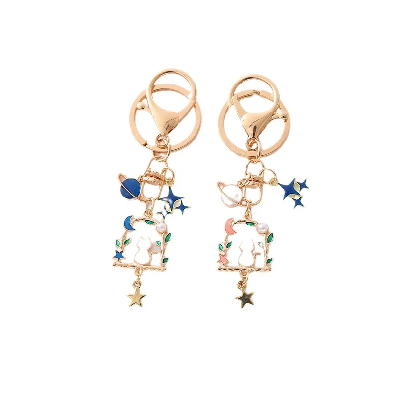 Portachiave Gatto bianco su altalena e stelle 216 Sd9f0056f7f3942ddb64958cde671fcdbk