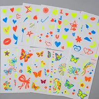 10 autocollants de tatouages temporaires néon UV, motifs variés (papillon, nœud, fleur, étoile, cœur), pour décorer le corps lors de festivals de musique et de soirées en club. 5