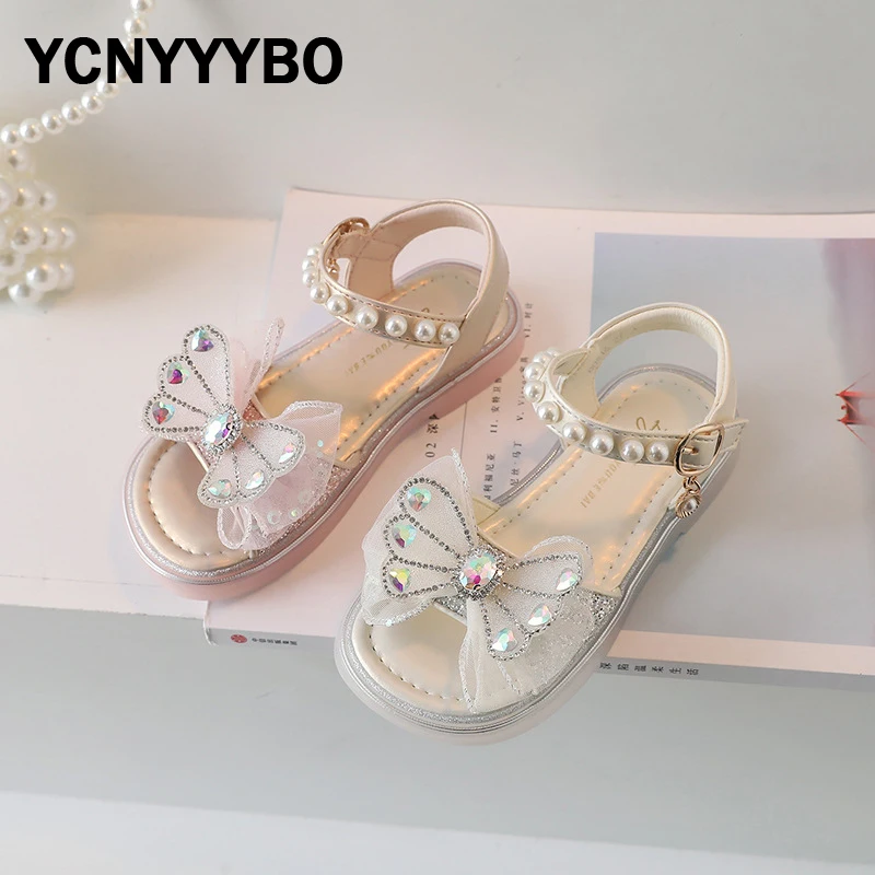 

Summer New Kids Bow Princess Sandals Baby Girls Rhinestone Beach Sandalias Children Beige Dress Shoes Fashion Slides Pearl Shoes